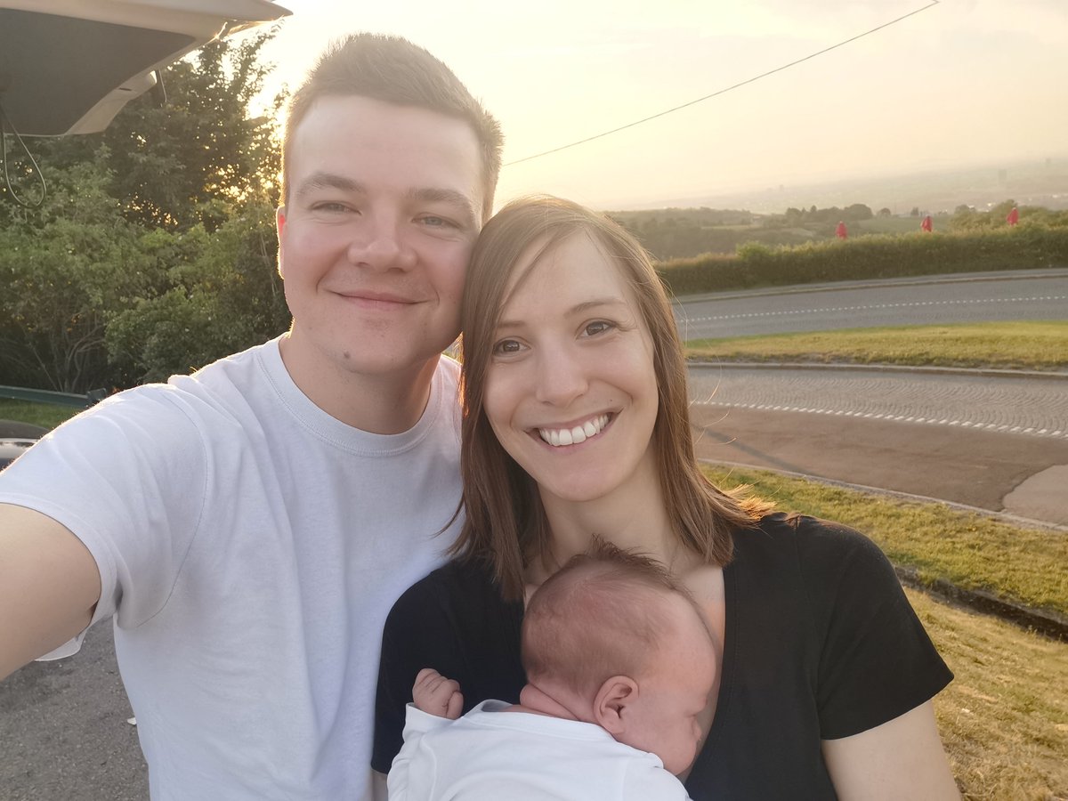 My fiance, me and 1 month old Johanna in front of a sunrise